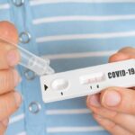 Rapid test on COVID 19 in hands of woman